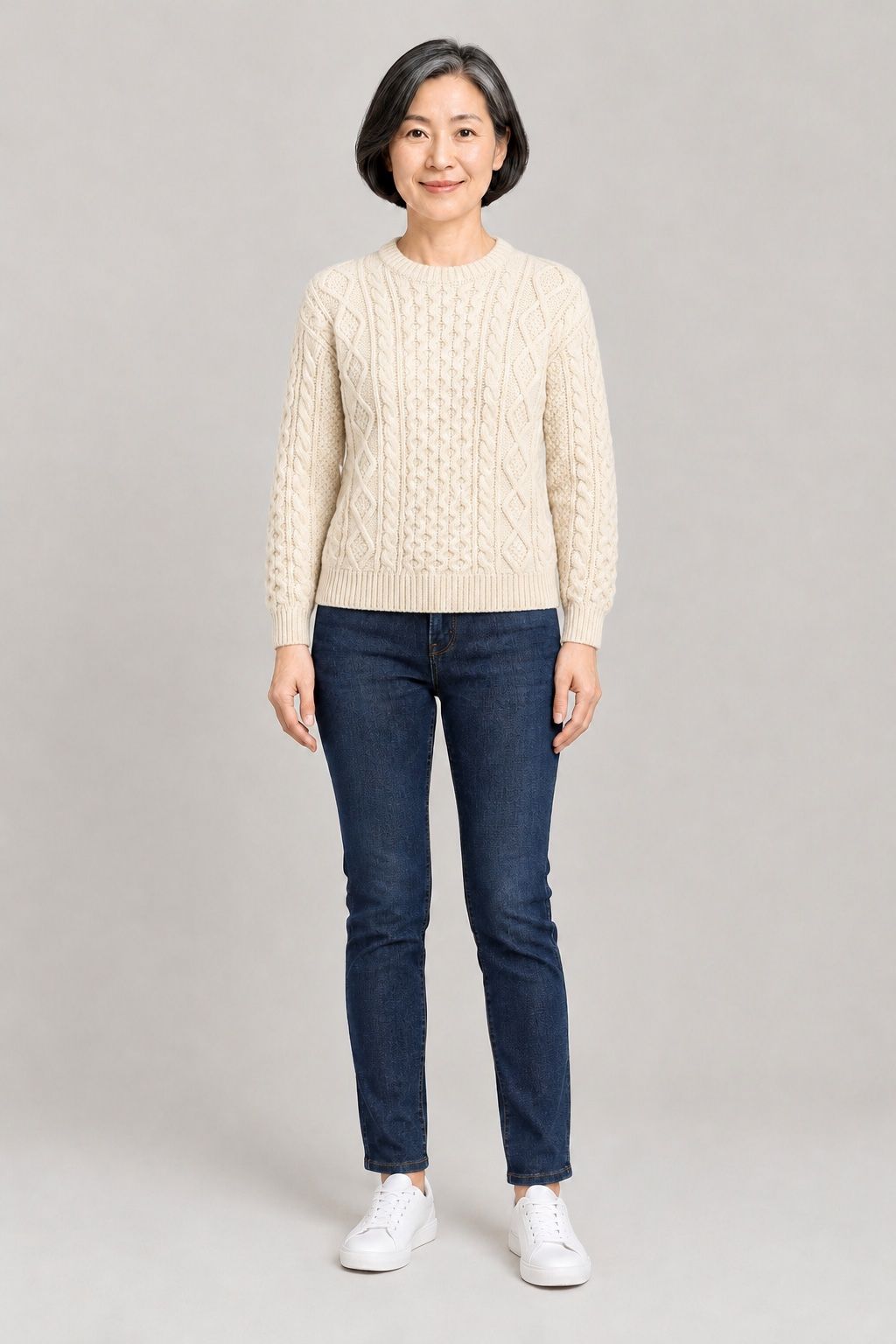 Linh wearing the cable-knit sweater after the try-on