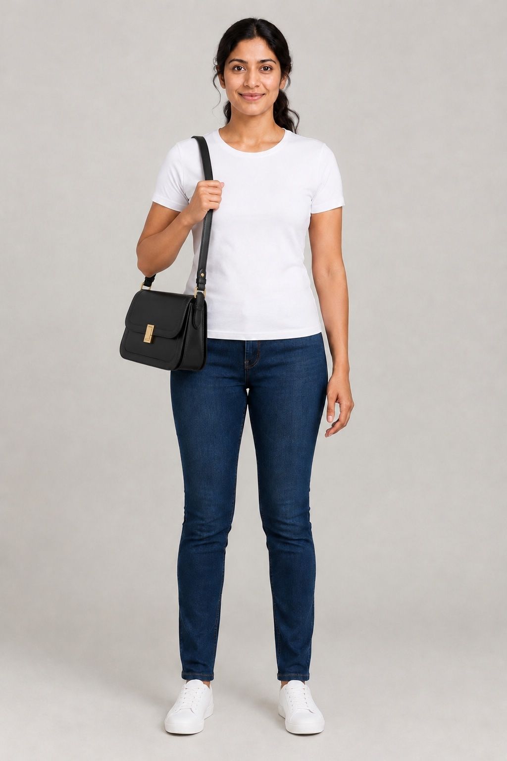 Priya wearing the leather shoulder bag